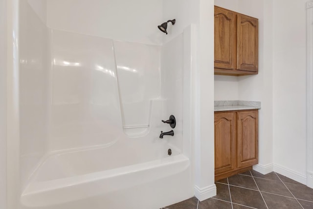 full bathroom with shower / bath combination, baseboards, and tile patterned floors