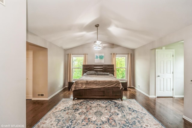 bedroom with dark wood-type flooring, lofted ceiling, multiple windows, and visible vents