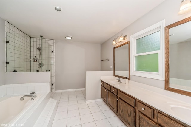 full bath with tile patterned flooring, a garden tub, a sink, a tile shower, and double vanity