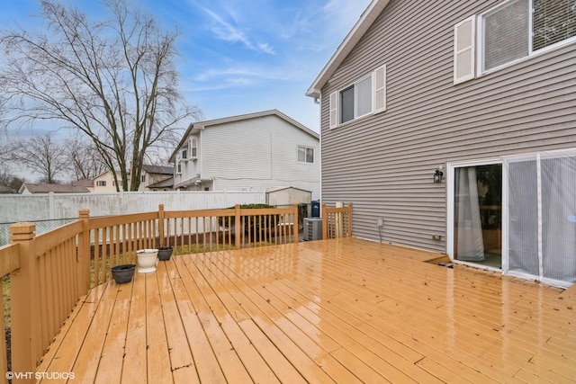 wooden terrace with fence private yard and cooling unit