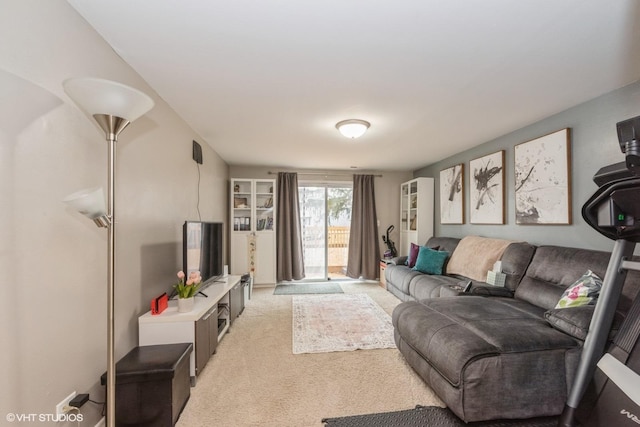 living area with light carpet