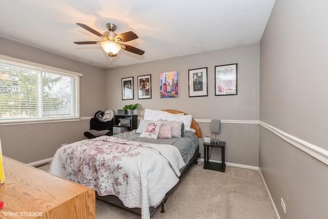 bedroom featuring a ceiling fan, baseboards, and carpet flooring