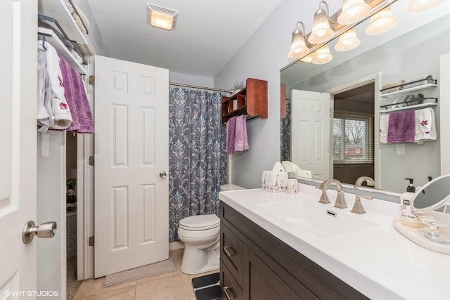 bathroom featuring toilet, tile patterned floors, visible vents, vanity, and a shower with curtain