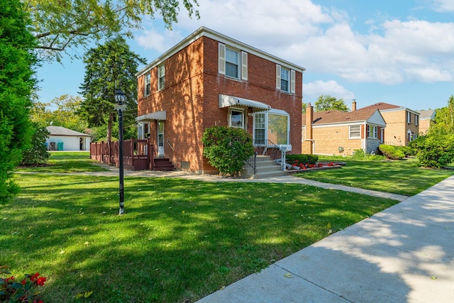 view of front of house featuring brick siding and a front lawn