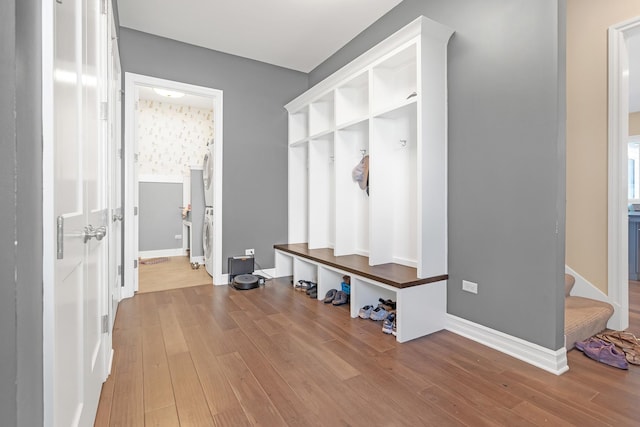 mudroom featuring baseboards and wood finished floors