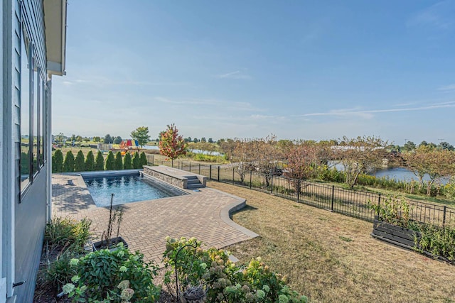 view of pool featuring a fenced in pool, a fenced backyard, a patio, and a lawn