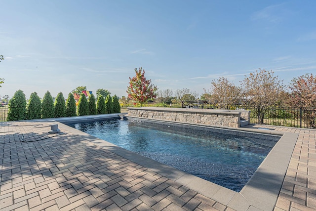 view of pool with a fenced in pool, a patio, and fence