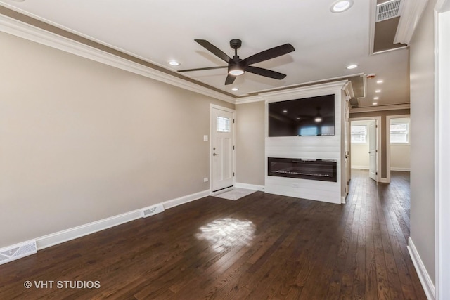 entryway with visible vents, dark wood-style flooring, and ornamental molding