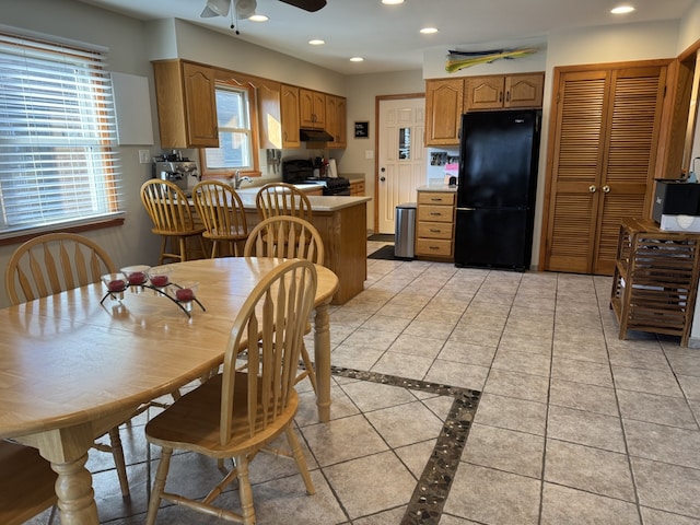 dining room with a ceiling fan, recessed lighting, and light tile patterned floors