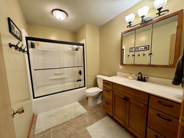 bathroom featuring shower / bath combination with glass door, vanity, and toilet