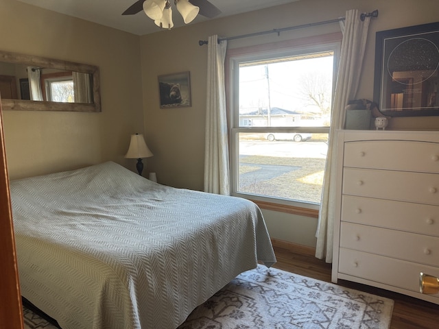 bedroom with wood finished floors and a ceiling fan