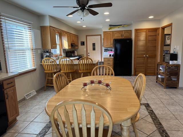 dining area with light tile patterned floors, recessed lighting, a ceiling fan, baseboards, and visible vents