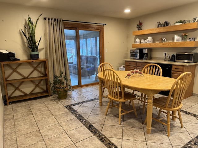 dining area with light tile patterned flooring and recessed lighting