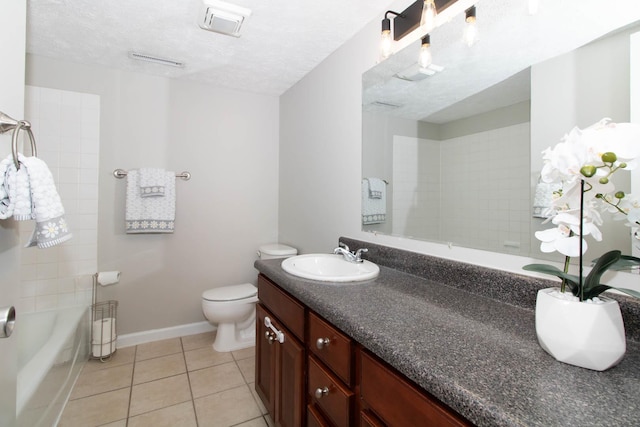 full bathroom with baseboards, toilet, vanity, tile patterned floors, and a textured ceiling