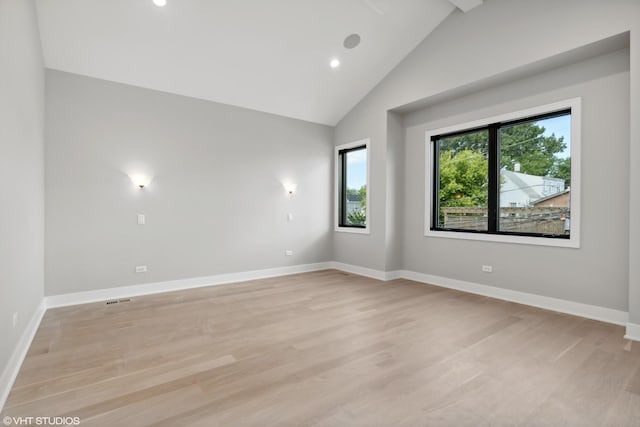 empty room with baseboards and light wood finished floors