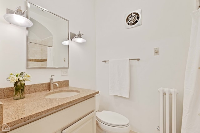 full bathroom with toilet, radiator heating unit, visible vents, and vanity