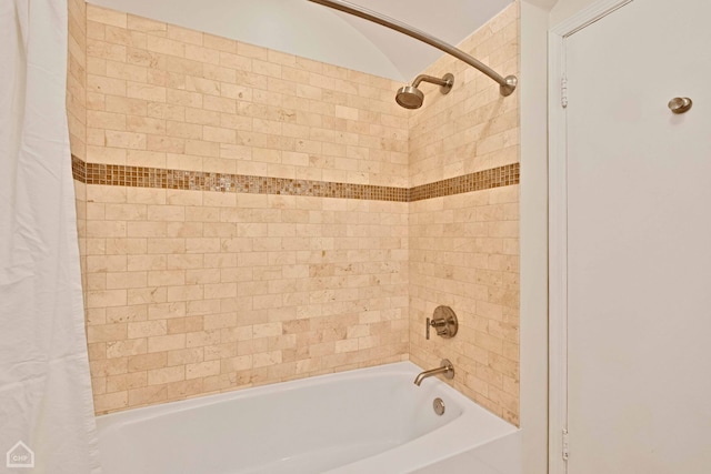 bathroom with shower / tub combo with curtain