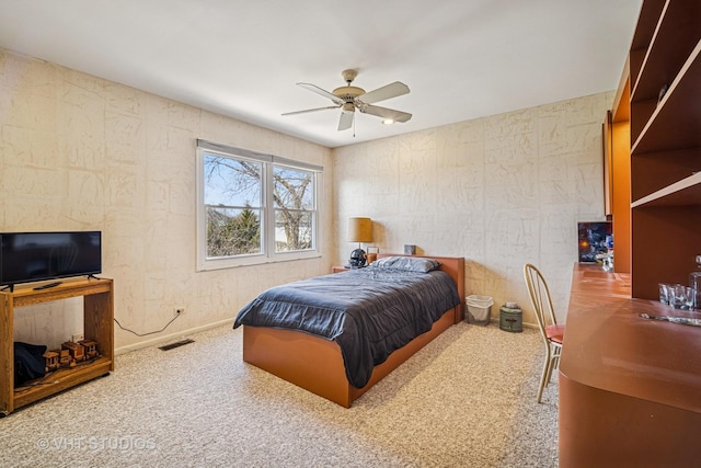 carpeted bedroom featuring visible vents, baseboards, and ceiling fan