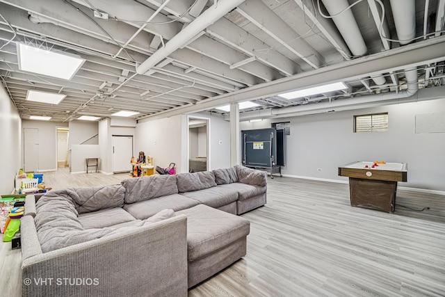 living room with baseboards and wood finished floors