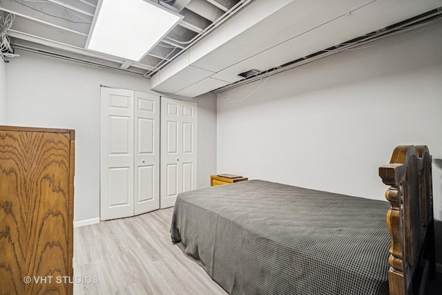 bedroom featuring a closet and wood finished floors