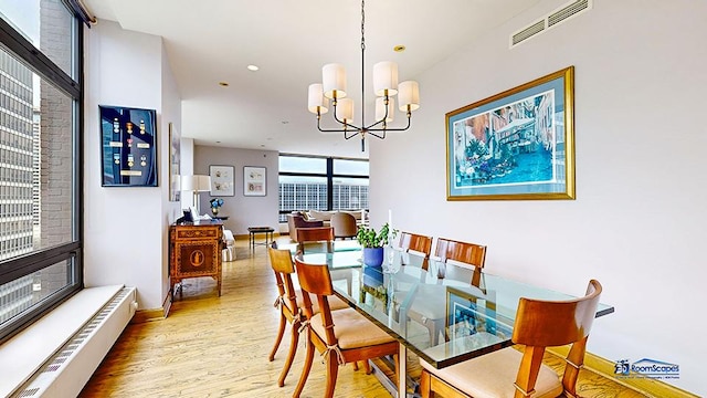 dining space featuring recessed lighting, visible vents, an inviting chandelier, wood finished floors, and baseboards