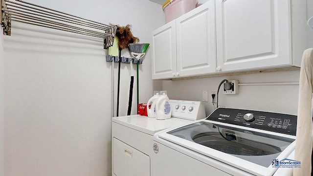 laundry area featuring cabinet space and separate washer and dryer