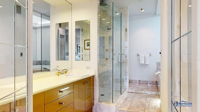 bathroom featuring a stall shower and vanity