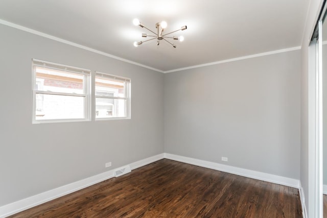 unfurnished room with visible vents, baseboards, ornamental molding, dark wood-type flooring, and a notable chandelier