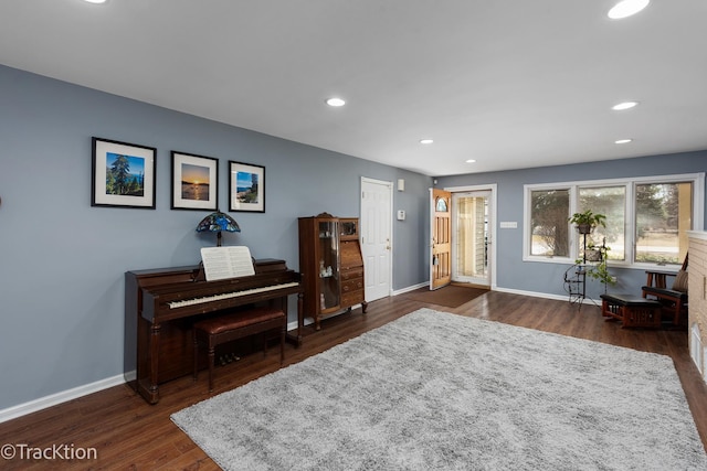 sitting room with recessed lighting, baseboards, and dark wood-style flooring