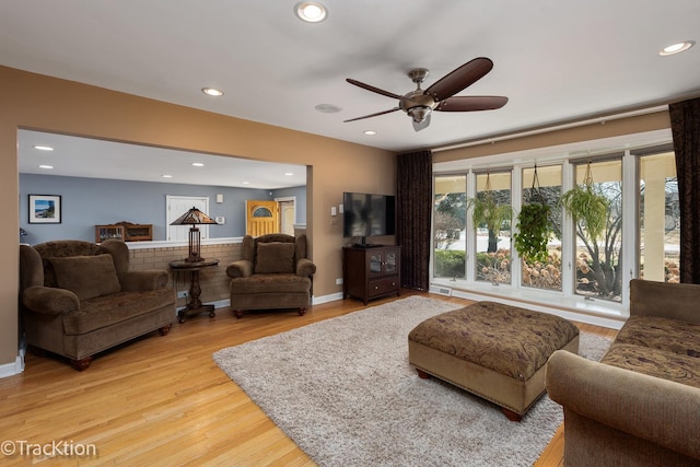 living area featuring recessed lighting, a ceiling fan, and light wood finished floors