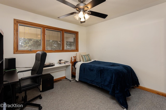 bedroom with a ceiling fan, baseboards, and carpet floors