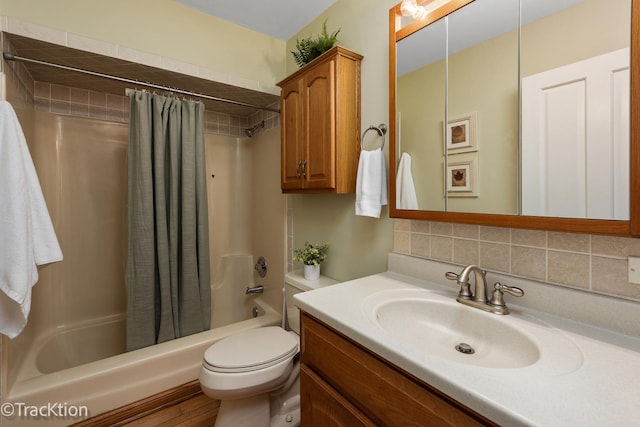 bathroom with vanity, toilet, backsplash, and shower / tub combo with curtain