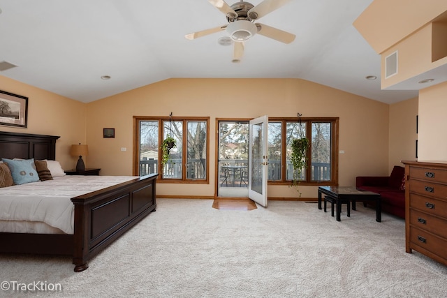 bedroom with multiple windows, lofted ceiling, light carpet, and visible vents