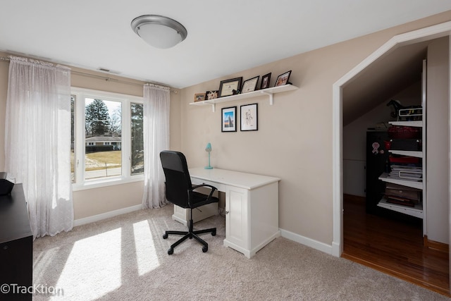 office space with visible vents, baseboards, and light colored carpet