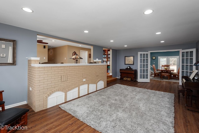 living area featuring recessed lighting, french doors, baseboards, and dark wood-style floors