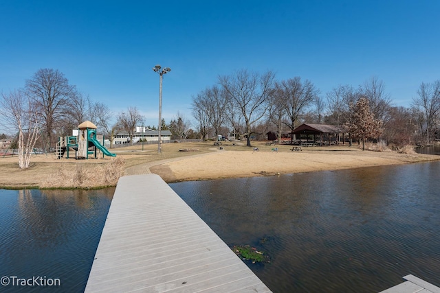 dock area featuring a gazebo, playground community, and a water view