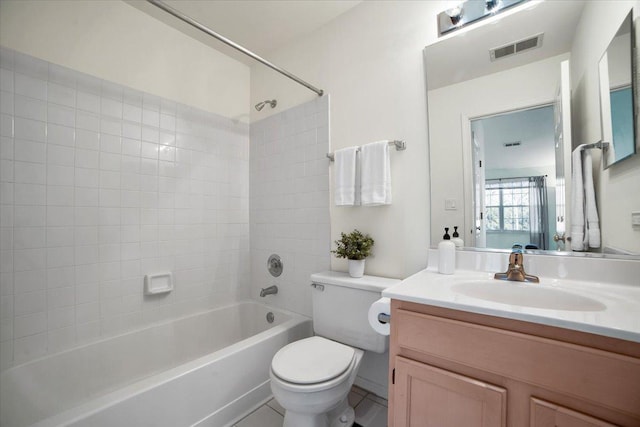 bathroom featuring visible vents, toilet, vanity, tile patterned floors, and washtub / shower combination