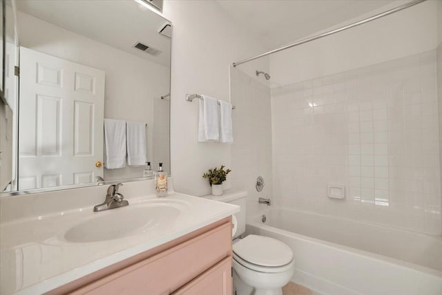 bathroom featuring vanity, toilet, visible vents, and shower / bathtub combination