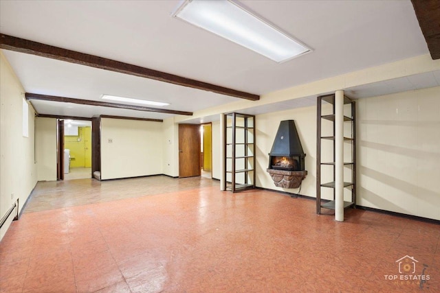basement with tile patterned floors and baseboards