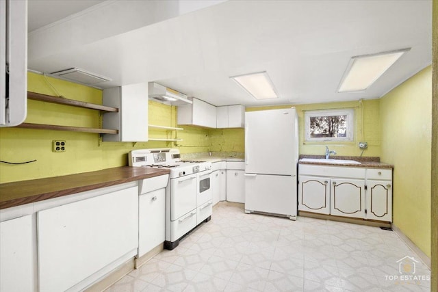 kitchen featuring a sink, light floors, white cabinetry, white appliances, and extractor fan