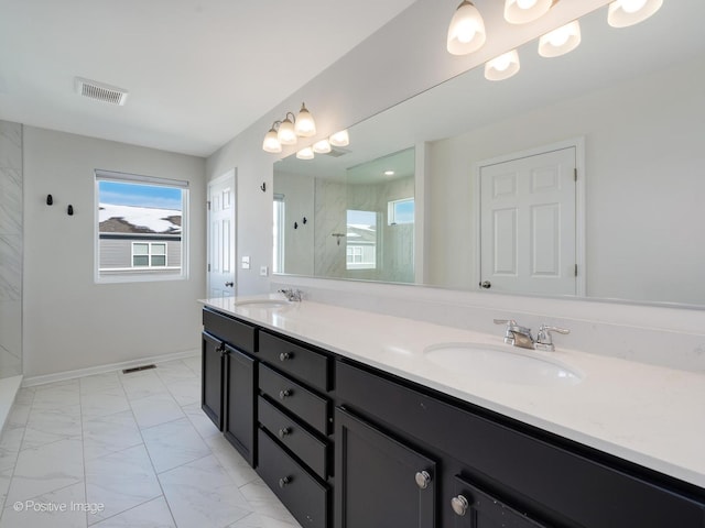 full bathroom featuring a sink, visible vents, and marble finish floor