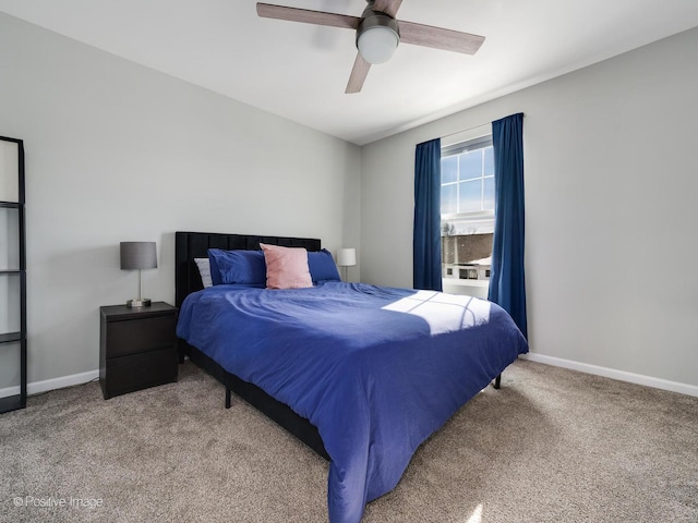 carpeted bedroom featuring a ceiling fan and baseboards