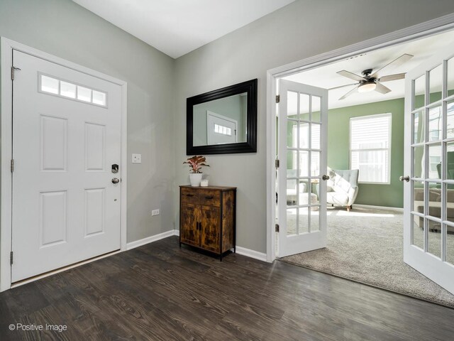 entrance foyer with french doors, baseboards, dark wood-type flooring, and a ceiling fan