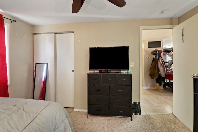 bedroom with visible vents, a closet, and a ceiling fan