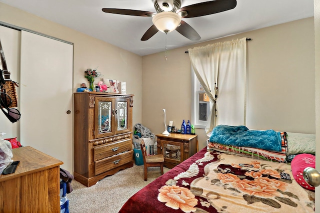 carpeted bedroom with a ceiling fan