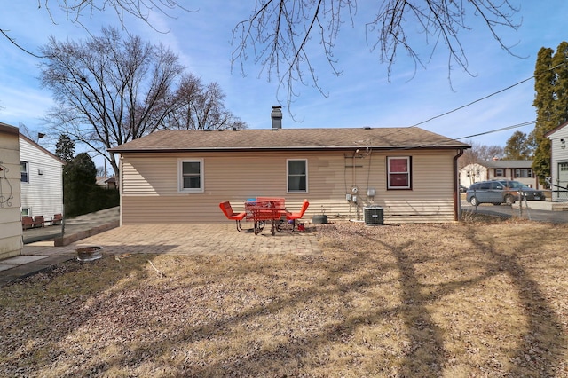 back of property featuring central AC, a patio, and fence