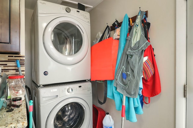 laundry area featuring stacked washer and clothes dryer