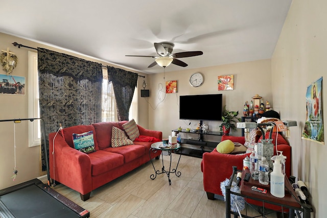 living area featuring ceiling fan