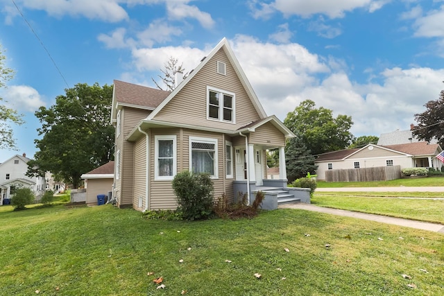 bungalow with a front lawn, a shingled roof, fence, and central air condition unit