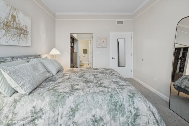 carpeted bedroom featuring ornamental molding, a closet, visible vents, and baseboards